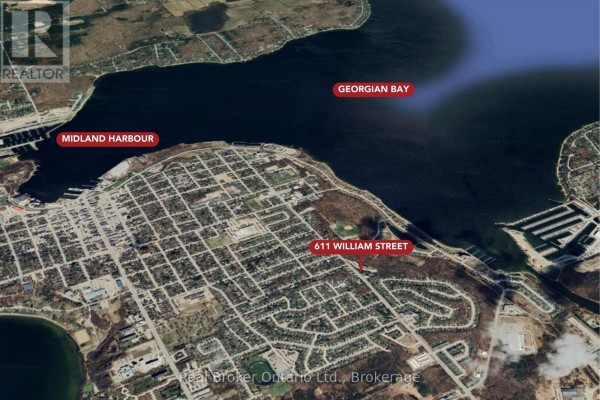 Aerial view of 611 William Street near Georgian Bay and Midland Harbour. - 611 William Street, Midland