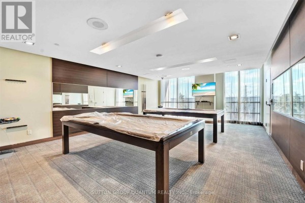 Room with two pool tables covered in plastic, carpeted floor, and mirrored walls. - 612 - 205 Sherway Gardens Road, Toronto