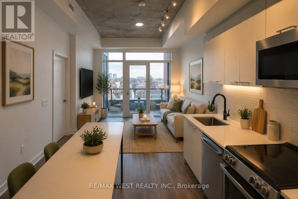 Living area with a sectional sofa, coffee table, dining table, kitchen with white cabinets and stainless steel appliances. - 614 - 1808 St Clair Avenue W, Toronto