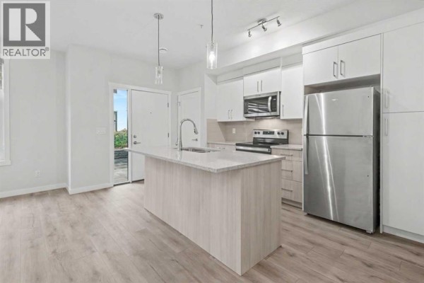 Living room - 615, 400 Belmont Street Sw, Calgary, AB T2X4C1 Photo 2