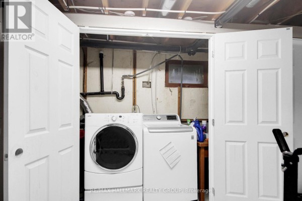 Washer and dryer in basement laundry room with exposed pipes - 6151 Malakoff Road Ottawa
