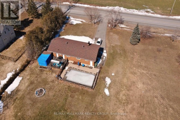 Inground pool, deck, fire pit, and brick house exterior - 6151 Malakoff Road Ottawa