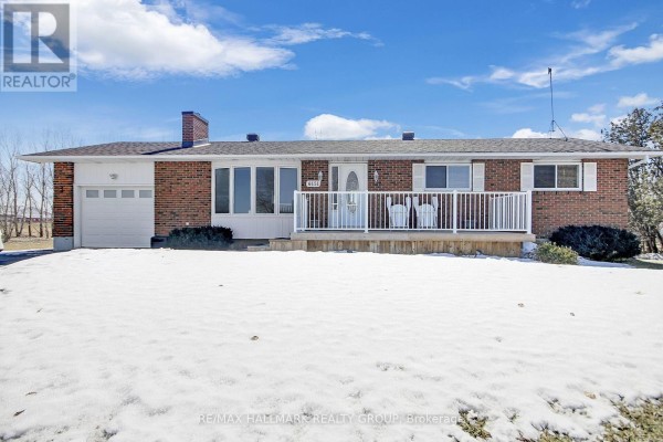 Brick bungalow with attached garage and front porch - 6151 Malakoff Road Ottawa
