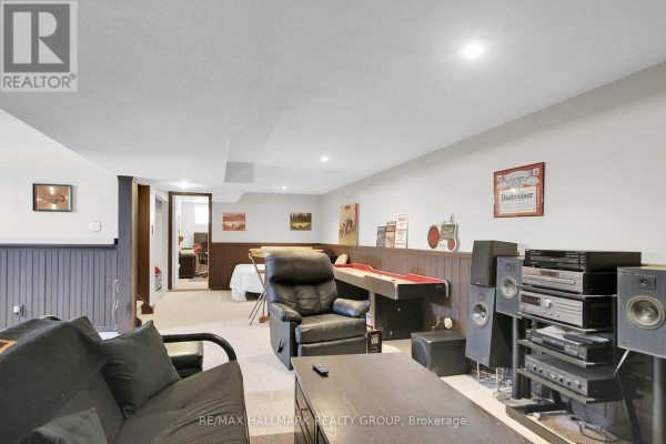 Finished basement with shuffleboard, recliner, sofa, and office - 6151 Malakoff Road Ottawa