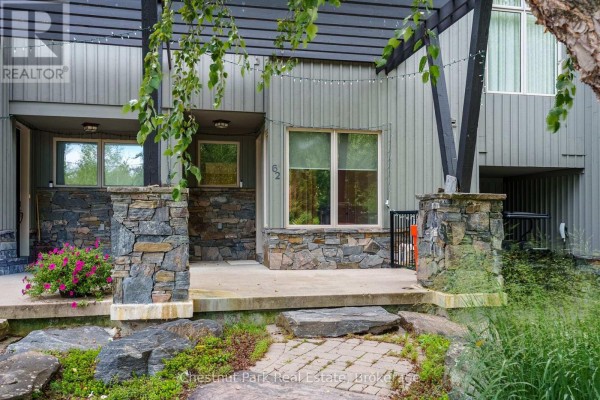 Close-up of townhouse entrance with stone pillar accents and number 62. - 62 Carrick Trail, Gravenhurst)