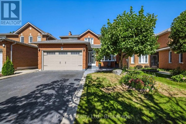 Exterior view of a brick house with a double garage and driveway. - 62 Castlehill Crescent, Brampton
