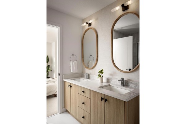 Bathroom vanity with double sinks, wood cabinets, oval mirrors, and pendant lighting. - 62 Cessy St, St  Albert