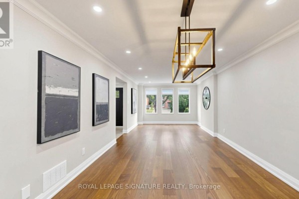 View of a large, open dining room with hardwood floors, modern art, and triple windows. - 62 Emeline Crescent, Markham
