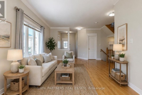 Bedroom with closet space, light-colored walls, and hardwood flooring. - 62 Macedonia Court, Newmarket