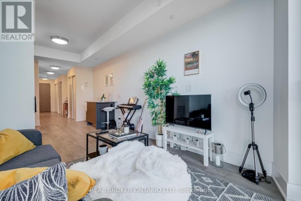 Hallway with numbered doors and carpeted flooring - 620 - 55 Merchants Wharf, Toronto