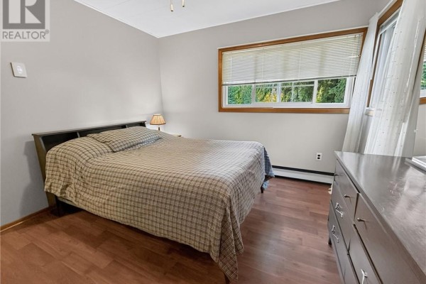 Bedroom with queen bed, dresser, and window - 6219 Highway 542 Mindemoya, Manitoulin Island