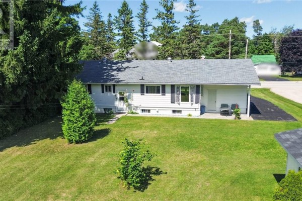 White house with bay window and dark shutters - 6219 Highway 542 Mindemoya, Manitoulin Island