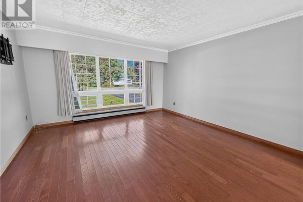 Living room with hardwood floors and large bay window - 6219 Highway 542 Mindemoya, Manitoulin Island