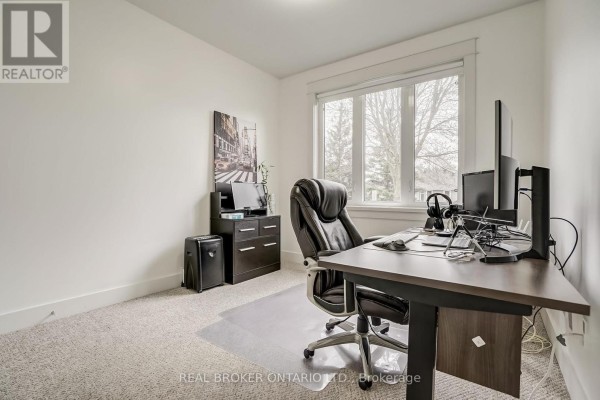 Bathroom with a tub, shower curtain, modern vanity, and dark cabinetry. - 6237 Perth Street, Ottawa