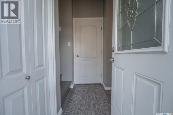 View from inside the front entrance, looking towards a hallway and closet doors. - 624 10th Street, Humboldt