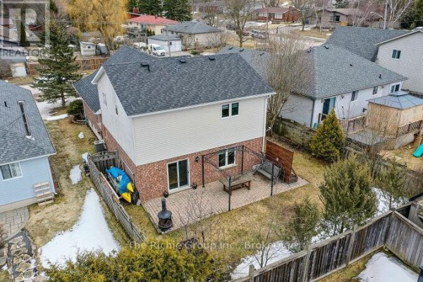 Backyard with patio, pergola, kayak, and slide - 624 Cedar Street W Shelburne