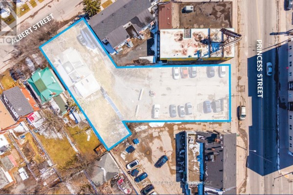 Aerial view of a property lot outlined in blue, showing existing structures and parking. - 627 Princess Street, Kingston