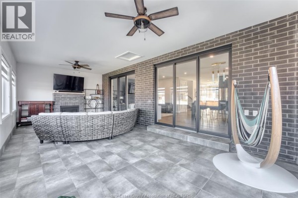 Modern kitchen with gray cabinets, stainless steel appliances, and tile floor - 6275 Disputed Rd. Lasalle