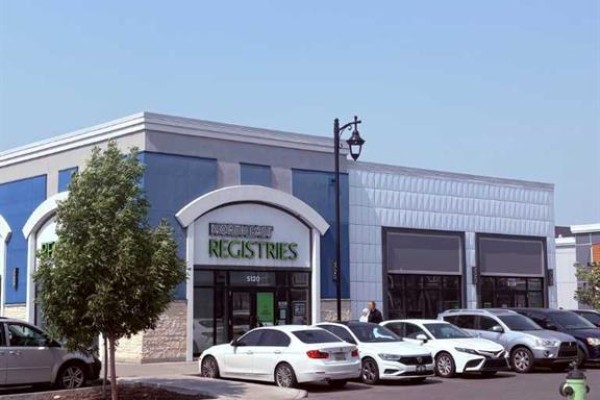 Northgate Registries storefront with a blue and grey facade and parked cars. - 6280, 5850 88th Avenue Ne, Calgary