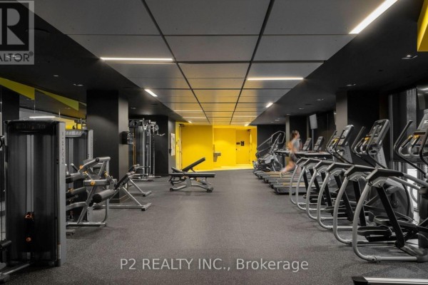 Well-equipped gym with treadmills, weight machines, and exercise benches. - 629 - 36 Zorra Street, Toronto