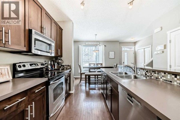 Bathroom with double vanity, modern fixtures, and neutral color scheme - 63 Chapalina Square Se, Calgary