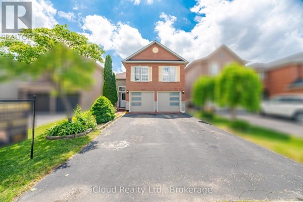 View of the house from the driveway with surrounding trees and lawn. - 6332 Glen Meadows Road, Mississauga
