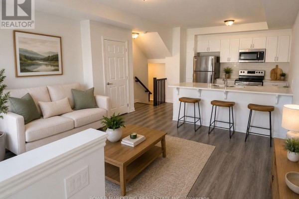 Open living area with hardwood flooring and access to kitchen - 641 Makwa Private, Ottawa