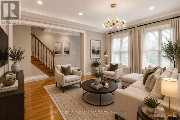 Bright home office with a white desk, chair, blue rug, and wood floors, with a staircase visible. - 649 Scott Boulevard, Milton