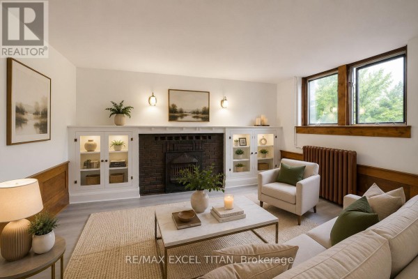 Bedroom with hardwood floors, white walls, and a small window. - 65 - 12 Kingston Road, Toronto