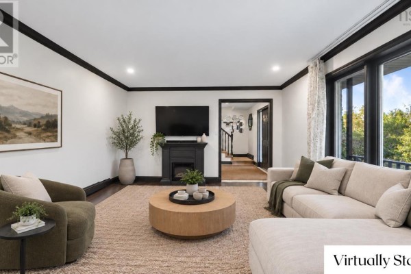 Basement room with exercise equipment including treadmills, stationary bikes, and weight machines. - 65 Lakehill Drive, Dartmouth