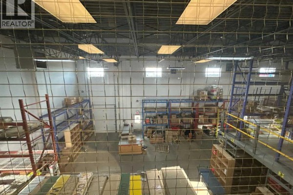 View from above showing warehouse space with shelving and storage - 655 14 Street Sw, Medicine Hat