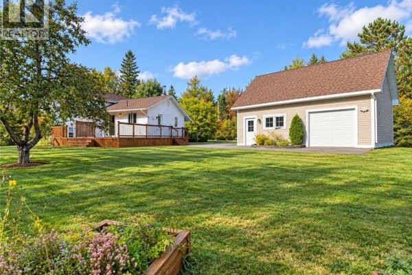 Rear view of white house and detached garage from backyard. - 656 Sureau Blanc, Tracadie