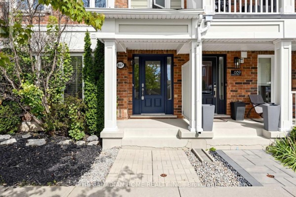 Close-up of the front entrance at 657 Cargill Path with a blue door. - 657 Cargill Path, Milton