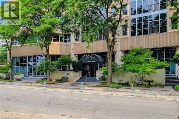 Entrance view of a Core Lofts apartment building with glass doors and signage. - 66 Bay Street S Unit# 414, Hamilton