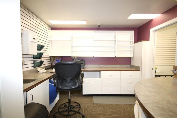 Interior view of pharmacy area with prescription drop-off and shelving - 66 Main Street S, Carman