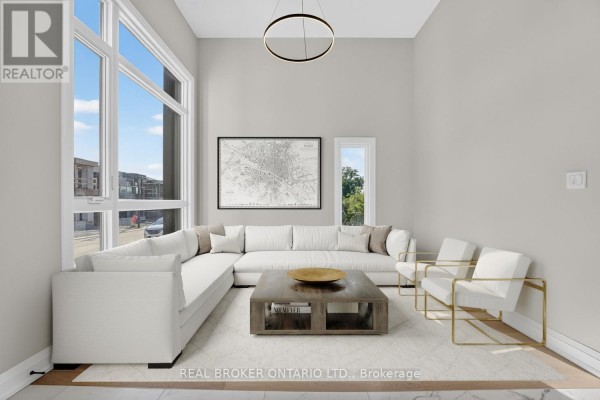 Living room features a large sectional sofa, expansive windows, and a modern circular light fixture. - 6632 Alexa Common, Niagara Falls