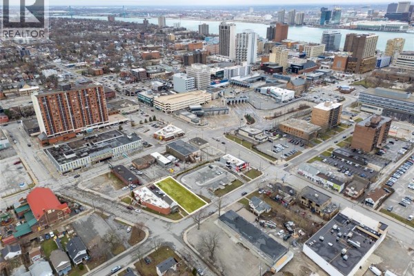 Wide aerial shot of the area, showcasing the lot and surrounding urban development. - 667 Windsor Avenue, Windsor