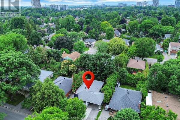 Aerial view of the house at 668 Fraser Avenue, surrounded by trees. - 668 Fraser Avenue, Ottawa
