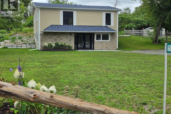 View of the house and property from the gravel driveway. - 6682 Wheeler Street, Stone Mills