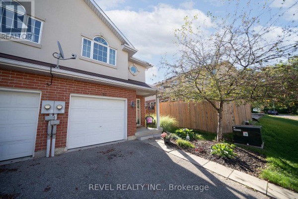 Powder room featuring toilet, sink, and tile flooring - 67 - 20 Mcconkey Crescent, Brantford