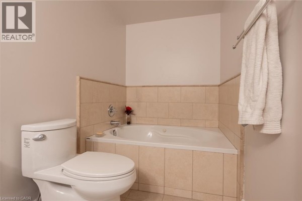 Corner soaking tub and toilet - 67 Caroline Street S Unit# 13a Hamilton