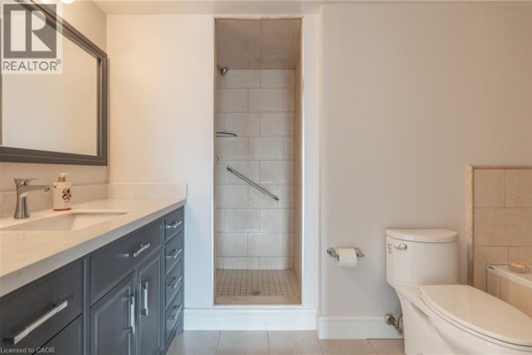 Double vanity and walk-in shower with grab bar - 67 Caroline Street S Unit# 13a Hamilton