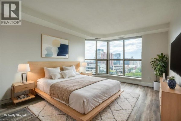 Bedroom with large windows and city view - 67 Caroline Street S Unit# 13a Hamilton