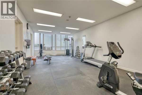Gym equipment including dumbbells, treadmills, and stationary bikes - 67 Caroline Street S Unit# 13a Hamilton