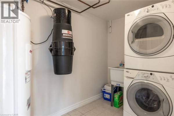 Stacked washer and dryer, utility sink, and central vacuum - 67 Caroline Street S Unit# 13a Hamilton
