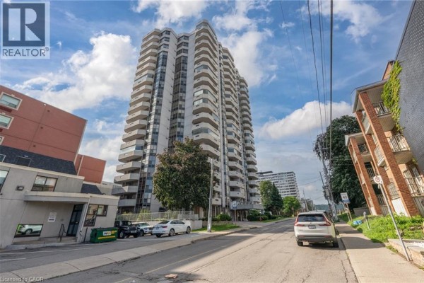 High-rise apartment building with balconies and street parking - 67 Caroline Street S Unit# 13a Hamilton