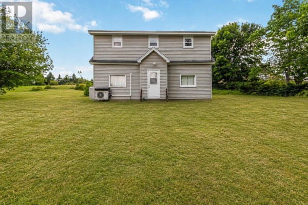 Front view of the house at sunset, showcasing snow and exterior lighting. - 67 Croft Avenue, Crescent Beach