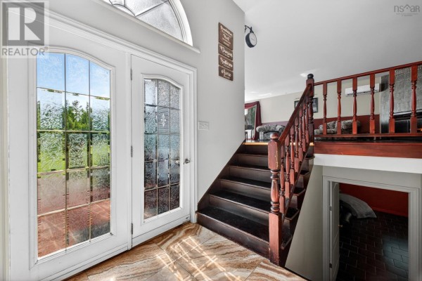 Bedroom with a sleigh bed, two nightstands, and a large window covered by burgundy curtains. - 675 Greenville Road, Greenville Station