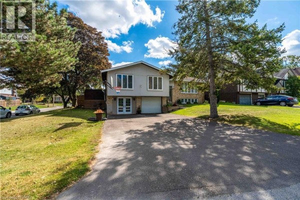View of the house from the driveway showing the front entrance and yard. - 68 Aberdeen Street, Caledonia