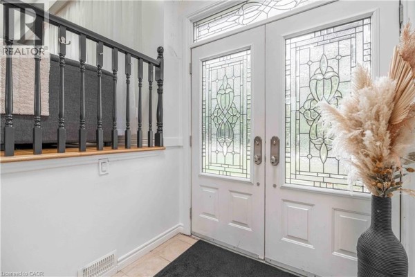 Interior view of the front foyer with white double doors and decorative glass panels. - 68 Aberdeen Street, Caledonia